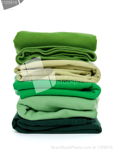 Image of Pile of green folded clothes