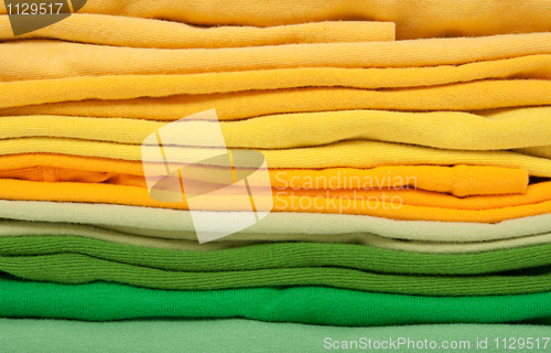 Image of Folded green and yellow clothes