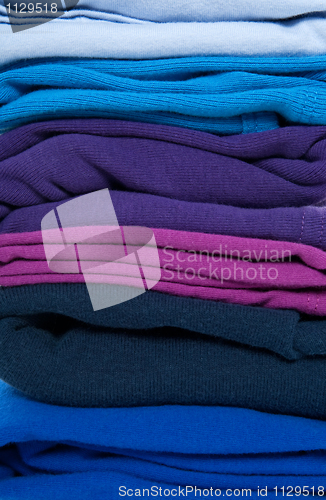 Image of Folded blue, purple and indigo clothes