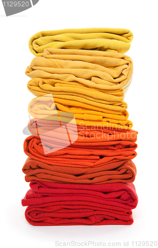 Image of Pile of red and yellow folded clothes