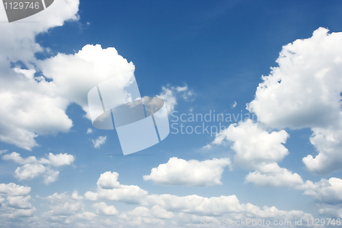 Image of The dark blue summer sky with clouds