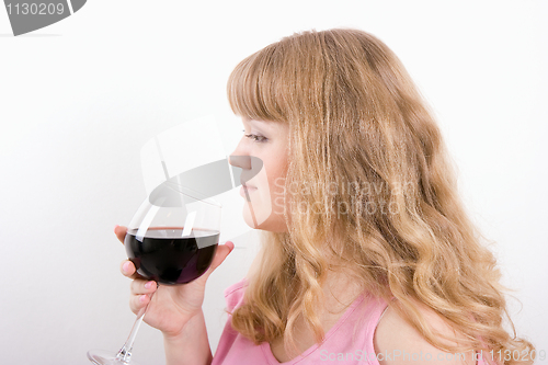 Image of The young woman with a wine glass