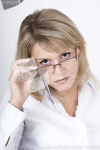 Image of The strict blonde in glasses