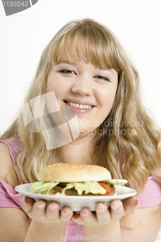 Image of The young girl with a hamburger