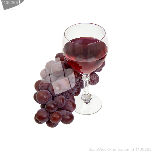 Image of Red grapes and glass with wine