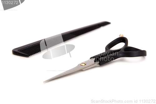 Image of Hairdresser's scissors and hairbrush