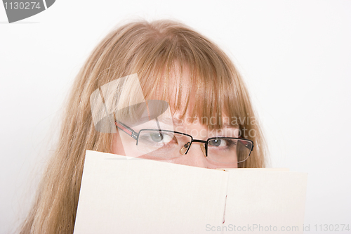 Image of The girl hides behind the book