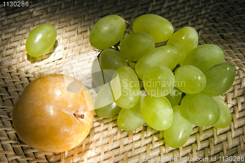 Image of Yellow plum and grapes