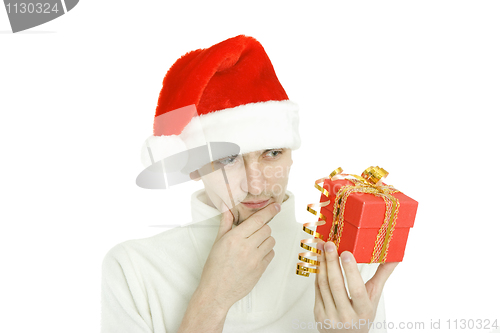 Image of The thoughtful man with gift in hand