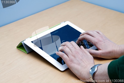 Image of iPad 2 tablet user hands typing