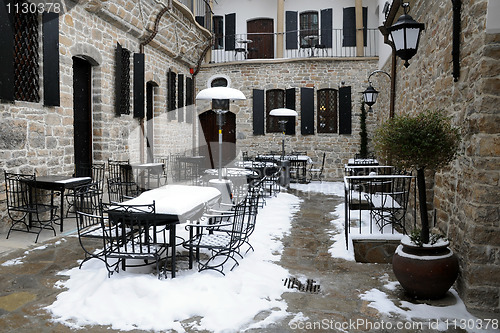 Image of Empty Courtyard Restaurant in the Winter