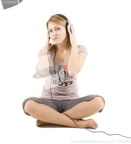 Image of The girl listens to music