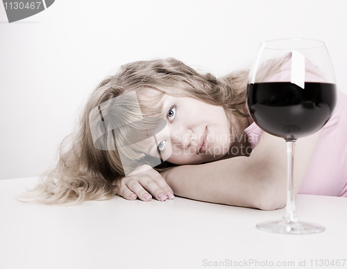 Image of The young woman with wine glass