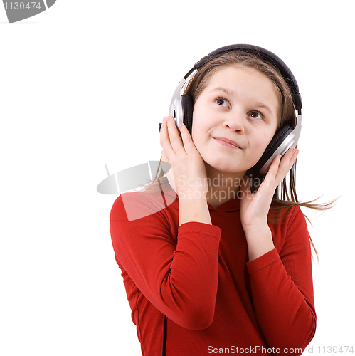 Image of The child listens to music