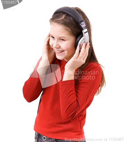 Image of The child listens to music