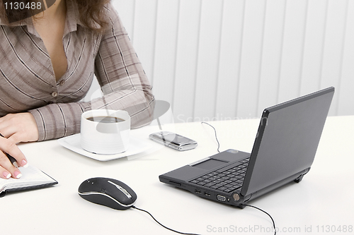 Image of The young business woman at office