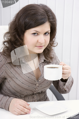 Image of The business woman drinks coffee