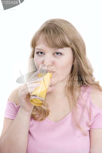 Image of The girl drinks orange juice