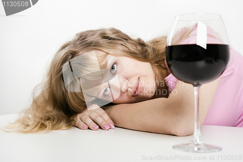 Image of The young woman with wine glass