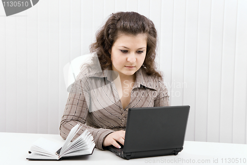 Image of The serious girl with the laptop