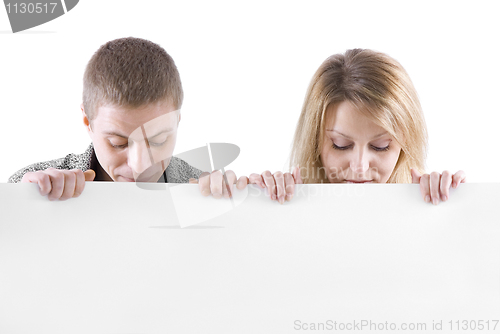 Image of man and the woman behind the white stand