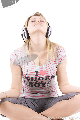 Image of The girl listens to music