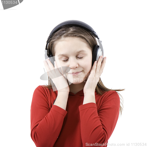 Image of The child listens to music
