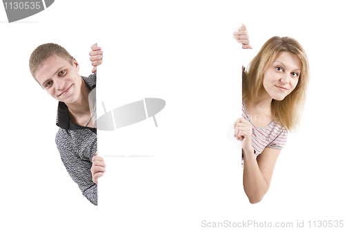 Image of Happy man and the woman behind the white stand