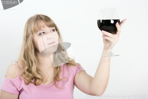 Image of The young woman with a wine glass