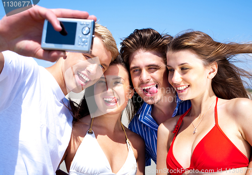 Image of Friends taking self portrait, outdoors