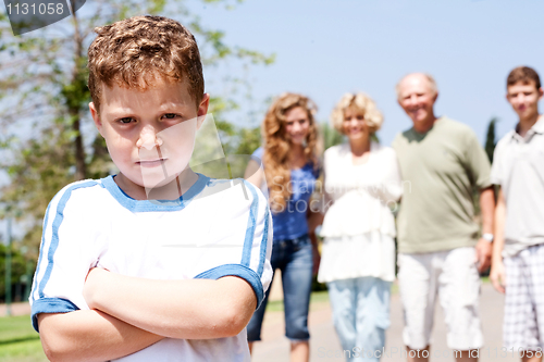 Image of Extended family posing,young child on focus