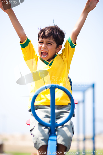 Image of Smart kid having fun, outdoors