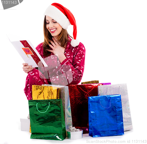 Image of young lady with christmas card and gifts