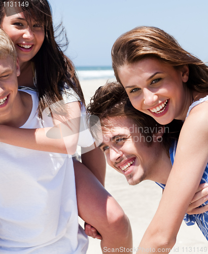 Image of Young women enjoying piggyback ride