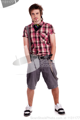 Image of Cool young guy with hands in his pockets