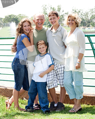 Image of Family posing infront of lake