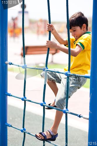 Image of Young boy on playstructure