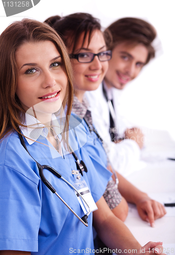 Image of Doctors in hospital gowns in row