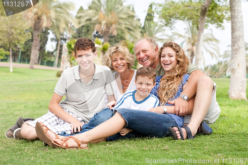 Image of family posing for camera
