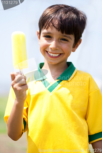 Image of Smiling kid holding an ice-cream