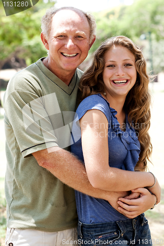 Image of Aged father embracing her daughter