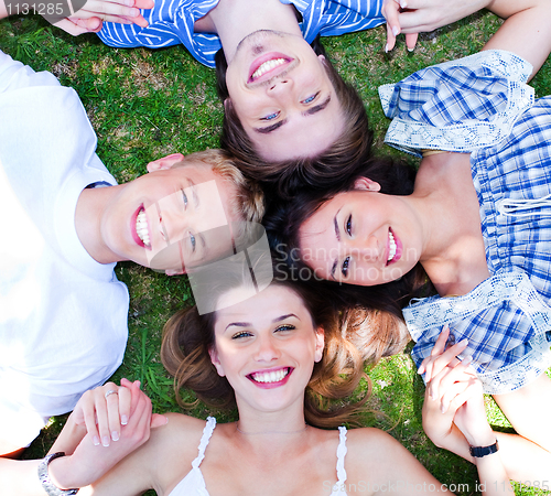 Image of Young friends forming a circle