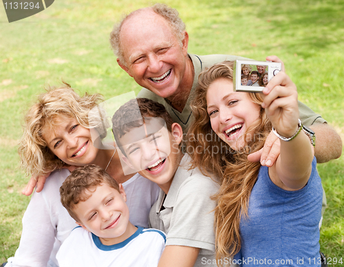 Image of Family outdoors taking self portrait