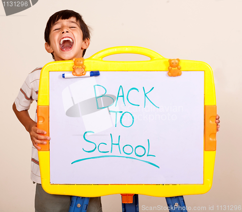 Image of Little boy screaming with a whitebaord