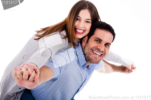Image of Young woman enjoying piggyback ride