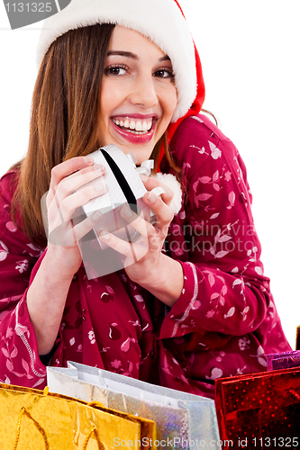 Image of young woman posing with christmas gift