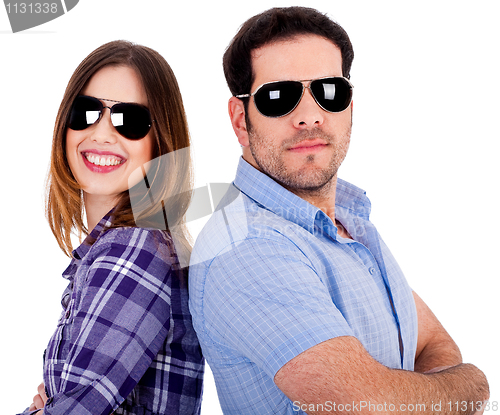 Image of stylish couple posing back to back