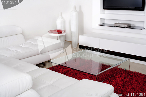 Image of Living space with white leather couch