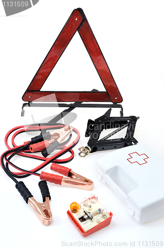 Image of Emergency kit for car - first aid kit, car jack, jumper cables, warning triangle, light bulb kit