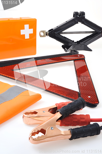 Image of Emergency kit for car - first aid kit, car jack, jumper cables, warning triangle, reflective vest